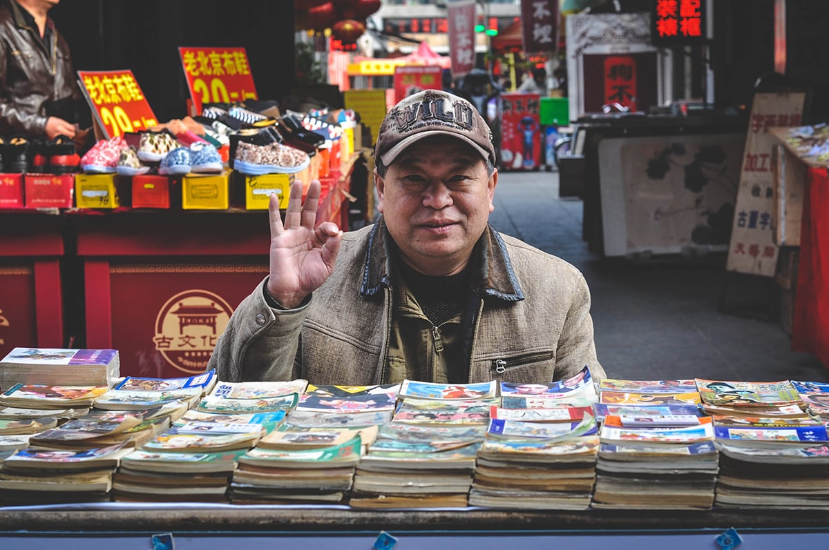 Man with comic books_1200.jpg